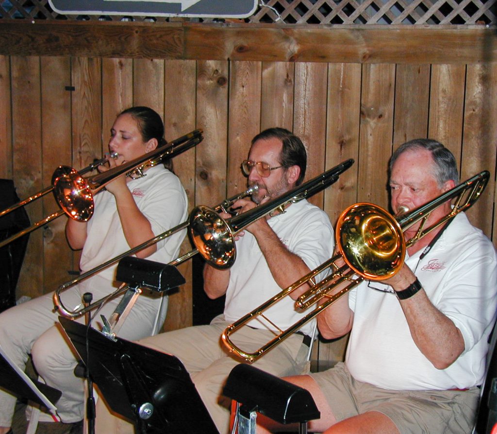Otsego Jazz Ensemble trombone section performing with the band at the former Bay Pointe Restaurant
